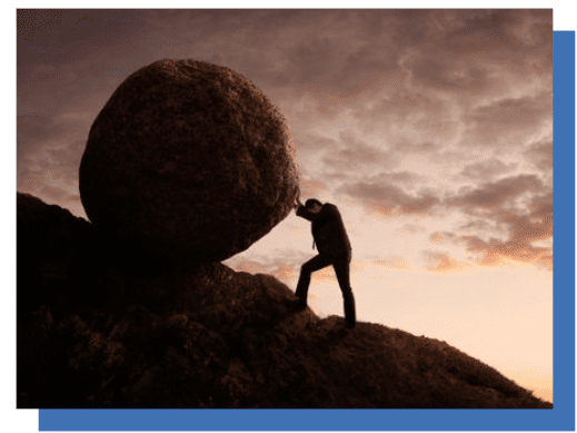 A person is pushing a rock up the hill